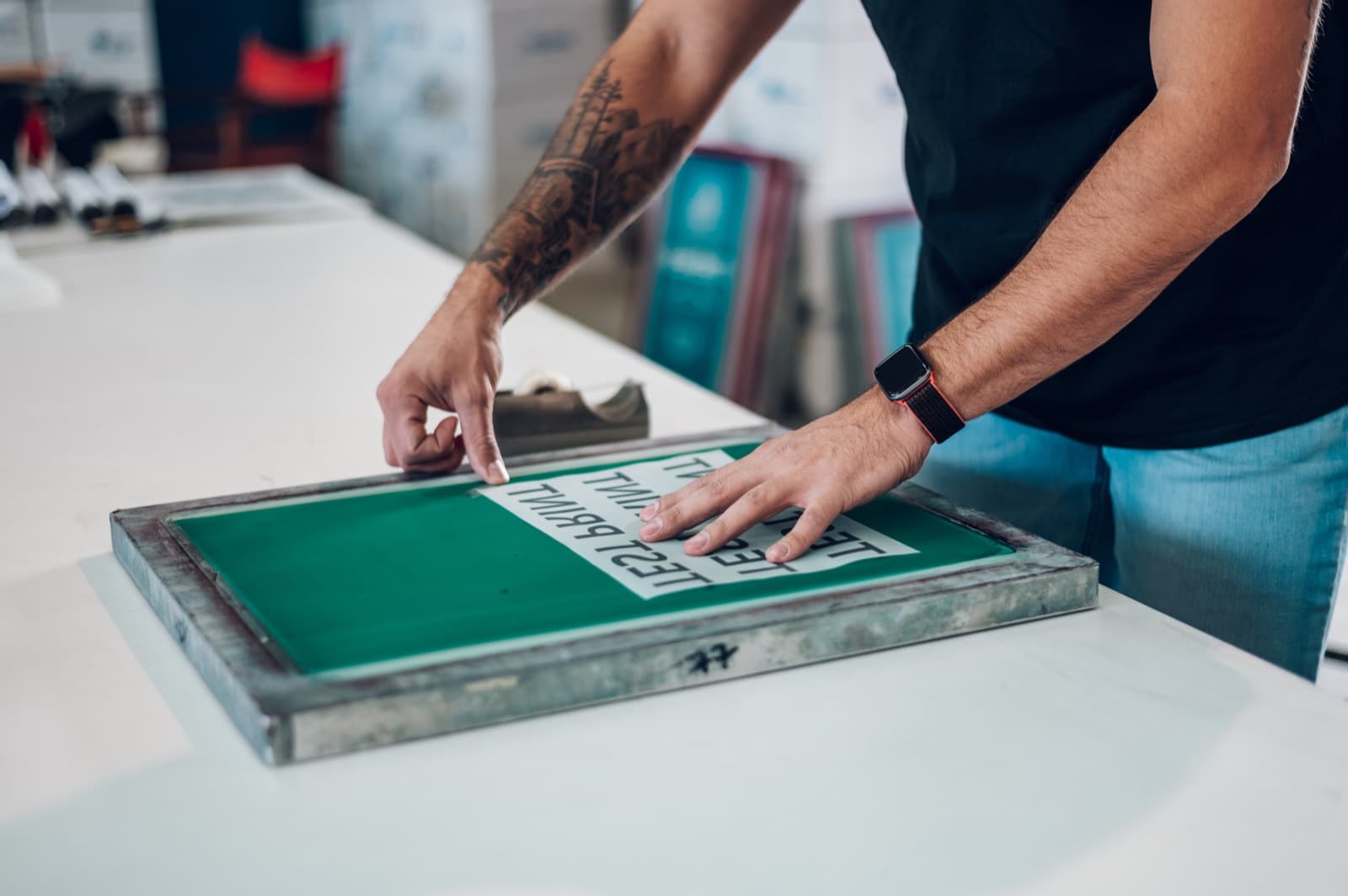 Preparing screen printing film in the shop